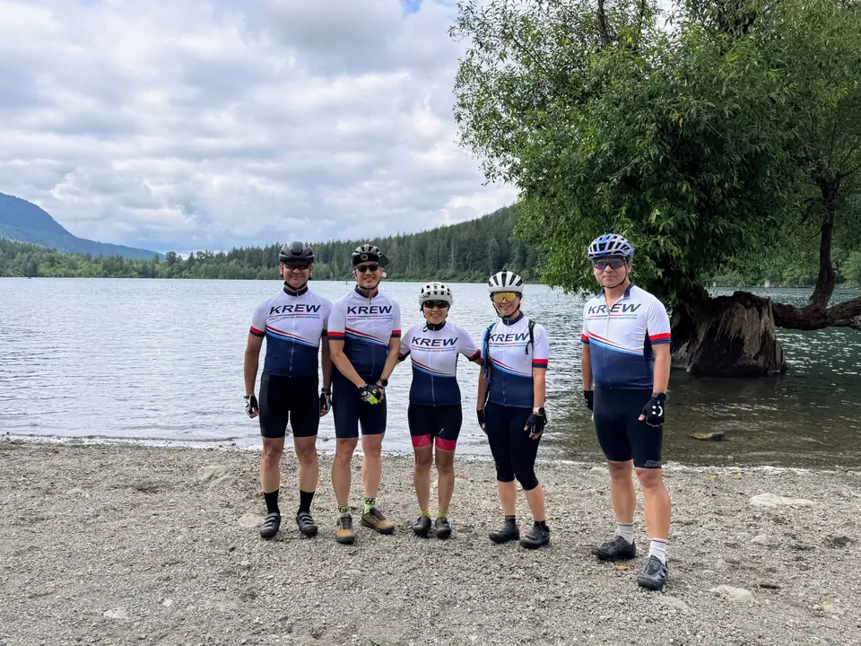 KREW riders by a mountain lake